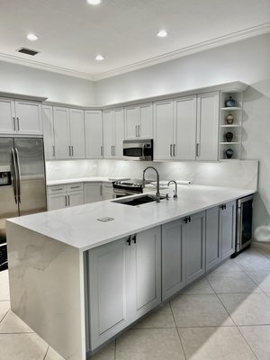 Kitchen Remodel - This remodel we replaced all cabinets to a shaker style doors dove white color with calacatta Quartz countertop and backsplash