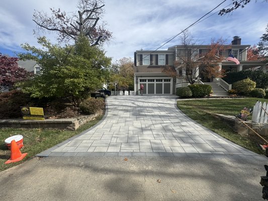 Blu 80mm Shale Grey Driveway with Onyx Black Border – Arlington VA - This driveway transformation in Arlington, VA was completed using Techo-Bloc Blu 80mm pavers in Shale Grey with Onyx Black borders.
The existing asphalt driveway had significant cracking and drainage issues. Our team at California Concrete LLC fully excavated and replaced the base with #57 stone for optimal compaction and drainage, followed by a 1” bedding layer of #8 stone
Pavers were installed with laser-precision alignment, compacted, and joint-sealed for long-term durability. The Onyx Black border provides a sharp contrast and clean framing effect against the Shale Grey field.
The result is a low-maintenance, elegant, and high-strength paver driveway that adds curb appeal and lasting value to the home.
Do it once, do it right — California Concrete LLC. Blu 80mm Shale Grey Driveway with Onyx Black Border – Arlington VA - This driveway transformation in Arlington, VA was completed using Techo-Bloc Blu 80mm pavers in Shale Grey with Onyx Black borders.
The existing asphalt driveway had significant cracking and drainage issues. Our team at California Concrete LLC fully excavated and replaced the base with #57 stone for optimal compaction and drainage, followed by a 1” bedding layer of #8 stone
Pavers were installed with laser-precision alignment, compacted, and joint-sealed for long-term durability. The Onyx Black border provides a sharp contrast and clean framing effect against the Shale Grey field.
The result is a low-maintenance, elegant, and high-strength paver driveway that adds curb appeal and lasting value to the home.
Do it once, do it right — California Concrete LLC.