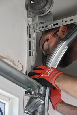 Garage Door Track Alignment - Wheels out of the track? Don't force it! We specialize in bent track repair, re-aligning vertical and horizontal rails, and securing track brackets. 20+ years of experience ensures proper spacing to prevent future jams. Call us now for urgent, safe repair! We're open 7 days a week. Garage Door Track Alignment - Wheels out of the track? Don't force it! We specialize in bent track repair, re-aligning vertical and horizontal rails, and securing track brackets. 20+ years of experience ensures proper spacing to prevent future jams. Call us now for urgent, safe repair! We're open 7 days a week.