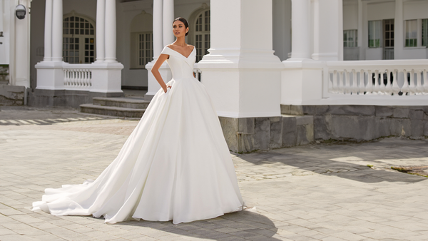 Designer: Pronovias - Modern.  Glamorous.  Fashion-led. A breakthrough bridal brand from the iconic designer, Vera Wang Bride, that creates artisanal and alluring creations for fashion-centric brides and celebrity weddings.