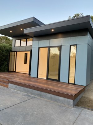 Melody - This ADU in Los Altos Hills is a ground-up build crafted as a modern architectural statement, balancing bold lines with thoughtful simplicity. From excavation to finish, every phase was meticulously executed by Selador Construction to bring the design vision to life.
The structure is defined by its flat roof and tiered ceiling volumes, creating an interplay of height and light throughout the space. We framed this project with dimension in mind—varying plate heights and clean transitions deliver a sense of openness and rhythm while giving each room its own identity. High-efficiency Western sliding & bi-fold doors and Andersen 100 series windows are placed strategically for optimal daylighting and indoor-outdoor integration, seamlessly connecting the living space to the pool and landscape beyond.
Exterior cladding features a mix of smooth panel siding & smooth stucco with deep reveals, emphasizing the home’s geometry and shadow play. The custom-built hardwood deck floats over a waterproof drainage system—an engineering solution that maintains clean lines without compromising on durability or drainage.
Inside, flush baseboards with ½” reglet reveals, wide plank engineered flooring, and soft white walls create a gallery-like backdrop for everyday living. Custom cabinetry, stone counters, and a sculptural kitchen island complete the space with function and refinement. This isn’t just an ADU—it’s a purpose-built dwelling, crafted with precision, restraint, and deep attention to the art of building well. Melody - This ADU in Los Altos Hills is a ground-up build crafted as a modern architectural statement, balancing bold lines with thoughtful simplicity. From excavation to finish, every phase was meticulously executed by Selador Construction to bring the design vision to life.
The structure is defined by its flat roof and tiered ceiling volumes, creating an interplay of height and light throughout the space. We framed this project with dimension in mind—varying plate heights and clean transitions deliver a sense of openness and rhythm while giving each room its own identity. High-efficiency Western sliding & bi-fold doors and Andersen 100 series windows are placed strategically for optimal daylighting and indoor-outdoor integration, seamlessly connecting the living space to the pool and landscape beyond.
Exterior cladding features a mix of smooth panel siding & smooth stucco with deep reveals, emphasizing the home’s geometry and shadow play. The custom-built hardwood deck floats over a waterproof drainage system—an engineering solution that maintains clean lines without compromising on durability or drainage.
Inside, flush baseboards with ½” reglet reveals, wide plank engineered flooring, and soft white walls create a gallery-like backdrop for everyday living. Custom cabinetry, stone counters, and a sculptural kitchen island complete the space with function and refinement. This isn’t just an ADU—it’s a purpose-built dwelling, crafted with precision, restraint, and deep attention to the art of building well.