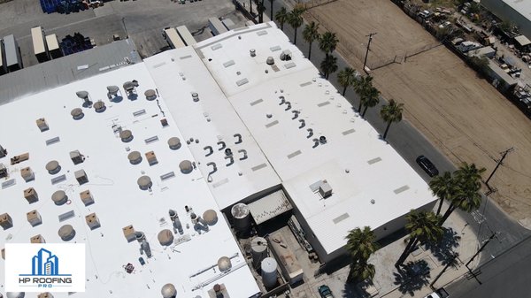Commercial Roofing Project in Colton, California - Installed a commercial cool roofing system over a bitumen and a corrugated metal roof. Commercial Roofing Project in Colton, California - Installed a commercial cool roofing system over a bitumen and a corrugated metal roof.
