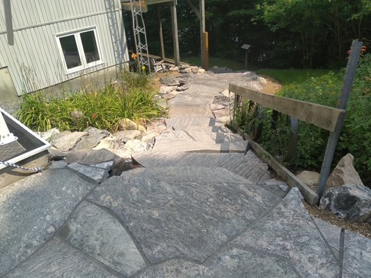 Granite Steps Down to Lake Before and After - The project was done for a very steep incline from the customer's house down to the lake. It greatly improved the safety of the descent. Granite gravel was used along the sides, as mulch would have ended up in the lake. :) Granite Steps Down to Lake Before and After - The project was done for a very steep incline from the customer's house down to the lake. It greatly improved the safety of the descent. Granite gravel was used along the sides, as mulch would have ended up in the lake. :)