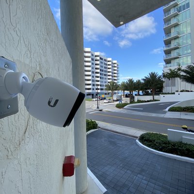 Surveillance camera solutions - Over the years, we’ve had the privilege of installing cutting-edge surveillance systems in a wide variety of environments. From family homes and luxury estates to commercial properties, dealerships, apartment complexes, and even challenging remote locations like the Everglades or islands off the mainland. Each project reflects our commitment to professionalism, precision, and the highest standards of security technology.

We believe that a truly smart home or business is only as strong as its security system. That’s why we focus on:

Advanced Technology: We offer PTZ cameras that function like a personal security guard at your fingertips, 360° cameras with AI detection, and high-resolution 4K systems that provide crystal-clear monitoring for any space.

User-Friendly Systems: Our apps are designed with the user in mind, programmed to each client’s unique needs. You can monitor, control, and receive alerts on your devices anytime, anywhere.

Comprehensive Coverage: From homes to sprawling farms, from apartment complexes to corporate campuses, our installations cover every angle and every square foot.

Reliability & Professionalism: Every project is installed meticulously, avoiding temporary fixes or messy setups. Cabling, camera placement, and system configuration are handled with precision to ensure long-term performance and ease of use.

AI & Smart Features: Modern security is more than just cameras; it’s intelligence. Motion detection, facial recognition, and smart alerts are just a few ways we ensure your property stays safe and monitored continuously.

We’ve partnered with local police departments to implement streetlight camera installations, improving community safety and enhancing surveillance coverage for public areas. That's how professional we've taken our levels in the surveillance security space.