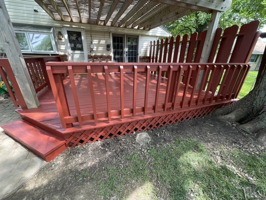 Deck Staining 2025 - this was a 16 x 16’ deck that we sanded pressure wash, then repainted, the red came out great along with the matching fence along the side