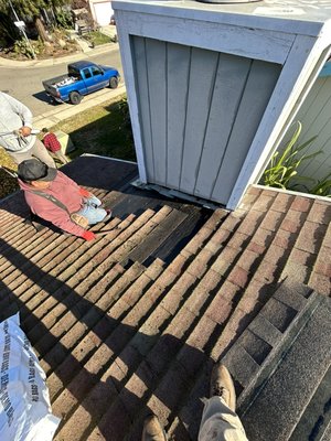 Chimney leak roof repair for asphalt shingles - Detected a leak coming from the chimney area that had damaged shingles , once the shingles were removed we noticed the tar paper was not installed properly from previous installers. 
More repairs were made such as tar paper patching and sealing .