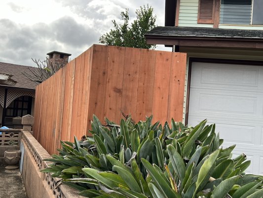 Redwood fence for privacy - Redwood fence installed with galvanized poles for privacy and sealed for durability Redwood fence for privacy - Redwood fence installed with galvanized poles for privacy and sealed for durability