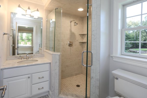 Bathroom remodel - We installed a new shower, vanity, lights, and floor tile.  The floor tile was matched to the shower deco pattern.