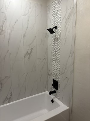 Bathroom Remodel WC - I am always happy to help a homeowner transform their space into something they really love and appreciate. For this bathroom remodel, the homeowner wanted to keep a functional tub while updating the space, giving it a more modern feel. By installing a "soaking" tub and using large format tiles and an accent tile, their vision was achieved. Bathroom Remodel WC - I am always happy to help a homeowner transform their space into something they really love and appreciate. For this bathroom remodel, the homeowner wanted to keep a functional tub while updating the space, giving it a more modern feel. By installing a "soaking" tub and using large format tiles and an accent tile, their vision was achieved.