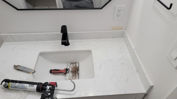Bathroom outlet relocation - small project, to move outlet a few inches up so back splash can be installed properly Bathroom outlet relocation - small project, to move outlet a few inches up so back splash can be installed properly