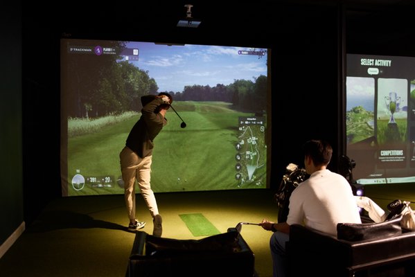 Inside look of AceGolf - Take a look at our space. Four TrackMan IO(indoor optimized) bay for your most accurate practice or simulator golf and a bar perfect for sports and drinks. Inside look of AceGolf - Take a look at our space. Four TrackMan IO(indoor optimized) bay for your most accurate practice or simulator golf and a bar perfect for sports and drinks.