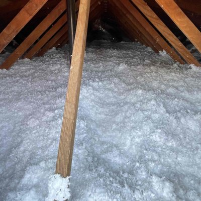 Blown Fiberglass Insulation - On this project we added 11.50" of blown fiberglass insulation to the attic floor. We also insulated the attic access hatch with polyiso foam board. Blown Fiberglass Insulation - On this project we added 11.50" of blown fiberglass insulation to the attic floor. We also insulated the attic access hatch with polyiso foam board.