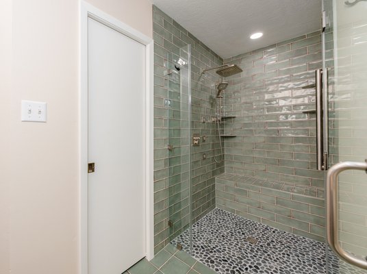 Bathroom Remodel - The primary bathroom was the central focus of this remodeling project. The clients aimed to make the shower more aging-in-place friendly, replace the tile floor with a more slip-resistant option, repaint the entire space, and upgrade the existing jetted tub to a new model with health-supportive features. In addition to the bathroom, we also replaced the front door. Bathroom Remodel - The primary bathroom was the central focus of this remodeling project. The clients aimed to make the shower more aging-in-place friendly, replace the tile floor with a more slip-resistant option, repaint the entire space, and upgrade the existing jetted tub to a new model with health-supportive features. In addition to the bathroom, we also replaced the front door.