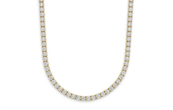 12ct Natural Diamond Tennis Necklace - A timeless 14K yellow gold tennis necklace featuring 11.8 carats total weight of natural round brilliant-cut diamonds. Expertly crafted with approximately 140 diamonds, this elegant necklace creates a continuous stream of brilliance that drapes beautifully along the neckline, offering exceptional sparkle and sophistication.
The classic tennis design is enhanced by the warmth of rich yellow gold, creating a look that is both luxurious and versatile. Equally suited for formal occasions, milestone celebrations, and elevated everyday wear, this necklace embodies the enduring appeal of fine diamond jewelry.
With its refined silhouette, substantial diamond presence, and timeless style, this piece is a remarkable addition to any jewelry collection. Add this exceptional diamond tennis necklace to your collection and enjoy its beauty and elegance for years to come. 12ct Natural Diamond Tennis Necklace - A timeless 14K yellow gold tennis necklace featuring 11.8 carats total weight of natural round brilliant-cut diamonds. Expertly crafted with approximately 140 diamonds, this elegant necklace creates a continuous stream of brilliance that drapes beautifully along the neckline, offering exceptional sparkle and sophistication.
The classic tennis design is enhanced by the warmth of rich yellow gold, creating a look that is both luxurious and versatile. Equally suited for formal occasions, milestone celebrations, and elevated everyday wear, this necklace embodies the enduring appeal of fine diamond jewelry.
With its refined silhouette, substantial diamond presence, and timeless style, this piece is a remarkable addition to any jewelry collection. Add this exceptional diamond tennis necklace to your collection and enjoy its beauty and elegance for years to come.