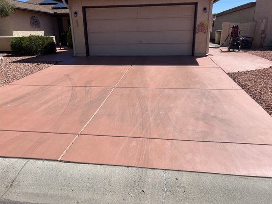 Re coat Driveway in Sun Lakes - This Customer wanted to update his driveway that had been painted multiple times and was peeling.

We took the old coating off and put the new coating on, making sure he had access in and out of his house, while we worked.
 
We used our 20 Inch orbital concrete floor grinder to take the base coat off with 30/60 double bar Jumbo medium bond diamond grinding attachments. We used a Hepa vacuum to keep the dust to a minimum. 
Once the previous coating was ground off, we used our pressure washer to clean the concrete. Once completely dry, we put a polyaspartic base coat down and added Chips Unlimited Desert Sunset chips to the base coat until rejection. Once dry, we scraped and vacuumed excess chips, we then used Resin Tek chem seal to help chips lay flatter, this is a step most competitors do not do. Then finally, the polyaspartic topcoat, 4x harder than epoxy and UV Resistant.