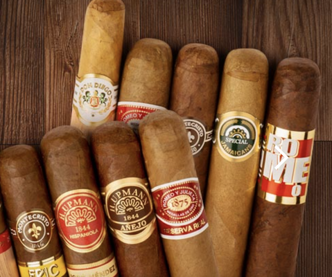 Premium Cigars - Not only do we provide liquor, but also a huge selection of Cigars. They are stored in a proper large humidor so they are kept fresh. Our selection is also always increasing with new brands. But if you still can’t find exactly what you are looking for, don’t hesitate to ask. We will do our best to order it for you. Premium Cigars - Not only do we provide liquor, but also a huge selection of Cigars. They are stored in a proper large humidor so they are kept fresh. Our selection is also always increasing with new brands. But if you still can’t find exactly what you are looking for, don’t hesitate to ask. We will do our best to order it for you.