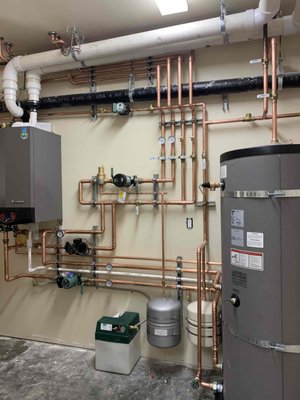 New System In Tahoe - High-efficiency boiler installation featuring a clean primary/secondary piping layout and professional-grade components New System In Tahoe - High-efficiency boiler installation featuring a clean primary/secondary piping layout and professional-grade components