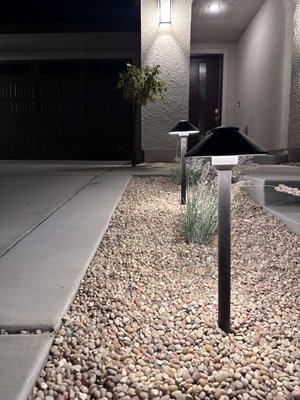 Front yard remodel - This remodel was done to new construction home, removed existing landscape. Added landscape lighting, decorative gravel, artificial turf, concrete steps.
