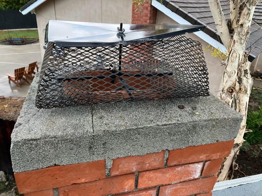 Chimney Rain Cap Installation - Customer requested a brand new rain cap and spark arrestor, which was finished off with a new crown installation. Chimney Rain Cap Installation - Customer requested a brand new rain cap and spark arrestor, which was finished off with a new crown installation.