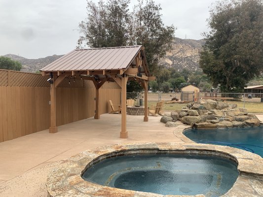 Pergola - We did the colored concrete around the pool, the pergola, the new fence and the fire ring.
