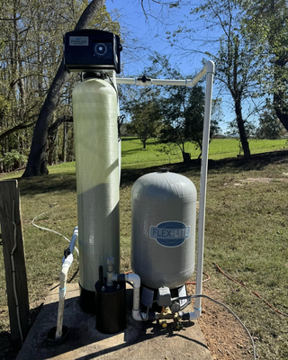 Water Filtration Services - We got this old decommissioned well back in service, but due to the iron and acidic levels we installed this filter. Sterling iron filters reduce the iron below the stain level and increase the pH if the raw water is acidic. The acid water corrodes copper and brass piping and valves. 
Give us a call today for all your filtration needs!