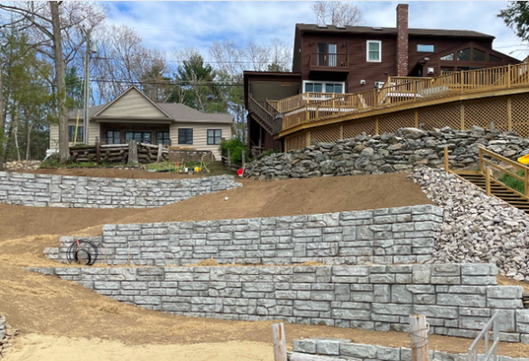 Shoreline Retaining Wall - From informal boulders to concrete block retaining walls, Solitro Property Solutions has the experience and attention to detail to transform your outdoor space. For this particular, retaining wall we demoed and disposed of the prior wooden fences on the steep slope and strategically installed concrete block retaining walls to create a more level yard area and for erosion control. How can we transform your property? Call or message for a FREE estimate at 401-477-6795. Shoreline Retaining Wall - From informal boulders to concrete block retaining walls, Solitro Property Solutions has the experience and attention to detail to transform your outdoor space. For this particular, retaining wall we demoed and disposed of the prior wooden fences on the steep slope and strategically installed concrete block retaining walls to create a more level yard area and for erosion control. How can we transform your property? Call or message for a FREE estimate at 401-477-6795.
