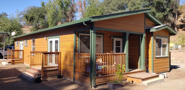 Fire Rebuild in Sonoma County - Here are two homes that were lost in a fire. We rebuilt them both. One is a standard 1500 SF home, the other is the size of a large ADU. We kept the roof pitch low not because we have to (we can do whatever roof pitch you want), we kept it low to save the client costs for the on-site work.
The siding that you see is a stained fiber-cement siding. This is a good product to use as it's non-combustible and meets the code for high fire areas (and it's not like wood that rots, subject to burning, etc.). Fire Rebuild in Sonoma County - Here are two homes that were lost in a fire. We rebuilt them both. One is a standard 1500 SF home, the other is the size of a large ADU. We kept the roof pitch low not because we have to (we can do whatever roof pitch you want), we kept it low to save the client costs for the on-site work.
The siding that you see is a stained fiber-cement siding. This is a good product to use as it's non-combustible and meets the code for high fire areas (and it's not like wood that rots, subject to burning, etc.).