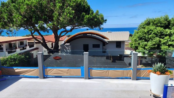 Patio Floor Epoxy & Deck Tile Installation - For this project, we completely upgraded the patio floor. First, we applied a high-quality epoxy coating to create a durable and waterproof base. After that, we installed decorative deck tiles on top, which not only improved the look but also added extra protection and comfort. The transformation gave the patio a modern, stylish appearance with a clean and long-lasting finish.

The client is now enjoying a refreshed outdoor space with an ocean view that is both practical and beautiful.