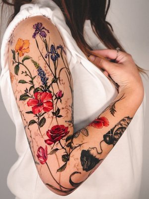 Floral/Nature/Human - Vism Studio's floral tattoos are characterized by their meticulous line work, thoughtful composition, and the ability to capture personal narratives through botanical imagery.