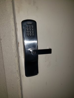 Standalone battery operated commercial keypad lock installed - Battery operated key pad lock installed on commercial building. Standalone battery operated commercial keypad lock installed - Battery operated key pad lock installed on commercial building.