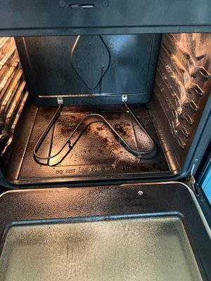 Oven deep cleaning - The oven is covered in grease and burnt-on food. The walls and racks have heavy buildup, and crumbs line the bottom. The glass door is stained and hard to see through. A strong burnt smell appears when it’s on. It needs deep cleaning. Oven deep cleaning - The oven is covered in grease and burnt-on food. The walls and racks have heavy buildup, and crumbs line the bottom. The glass door is stained and hard to see through. A strong burnt smell appears when it’s on. It needs deep cleaning.