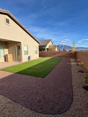Backyard Turf, Gravel & Pathway Installation - This backyard landscape features the installation of lush turf, two tone gravel, paver pathway, Irrigation and plants. Backyard Turf, Gravel & Pathway Installation - This backyard landscape features the installation of lush turf, two tone gravel, paver pathway, Irrigation and plants.