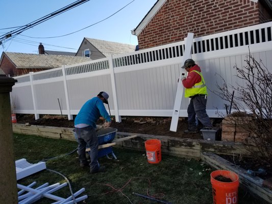 Custom Two-Tone PVC Privacy Fence with Spindle Top | Long Island Installation - The owner of this Long Island home was looking for a fencing solution that delivered both complete privacy and a high-end, modern aesthetic. They wanted a durable, maintenance-free option that would complement their home and serve as a stylish feature in their backyard.
Our Solution:
We recommended our custom two-tone vinyl (PVC) fencing. This design features a clean white frame and posts that create a sharp, defined border, while the solid light gray tongue-and-groove panels offer a subtle, contemporary contrast. The decorative spindle top was chosen to add an element of design flair, providing a sophisticated finish.
The Process & Outcome:
Our professional crew installed each section with precision and care, ensuring every post was securely anchored and perfectly level. The finished project is a stunning success, providing the homeowner with the desired seclusion while elevating the entire backyard space. This fence will never need painting or staining, offering decades of beauty and performance with minimal upkeep—a true investment in the property's value and the homeowner's enjoyment. Custom Two-Tone PVC Privacy Fence with Spindle Top | Long Island Installation - The owner of this Long Island home was looking for a fencing solution that delivered both complete privacy and a high-end, modern aesthetic. They wanted a durable, maintenance-free option that would complement their home and serve as a stylish feature in their backyard.
Our Solution:
We recommended our custom two-tone vinyl (PVC) fencing. This design features a clean white frame and posts that create a sharp, defined border, while the solid light gray tongue-and-groove panels offer a subtle, contemporary contrast. The decorative spindle top was chosen to add an element of design flair, providing a sophisticated finish.
The Process & Outcome:
Our professional crew installed each section with precision and care, ensuring every post was securely anchored and perfectly level. The finished project is a stunning success, providing the homeowner with the desired seclusion while elevating the entire backyard space. This fence will never need painting or staining, offering decades of beauty and performance with minimal upkeep—a true investment in the property's value and the homeowner's enjoyment.