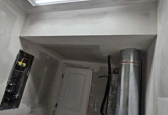 Laundry Room Drywall - Drywall repair in laundry room
- Instead of putting drywall on the ceiling under the venting system, we decided to frame it in a soffit around it. We also framed in a door with a header and sides, which turned out looking like it had always been there. And even though drywall work creates a mess, we always clean up each day to lessen the final cleanup. 

Contact A1 Do It All Drywall, Plaster Repairs for anyone in need of drywall and plaster repairs, or water damage restoration.