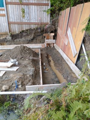 Retaining wall - This retaining wall was over 4 feet which required engineering and inspections. We formed and placed concrete for wall Retaining wall - This retaining wall was over 4 feet which required engineering and inspections. We formed and placed concrete for wall