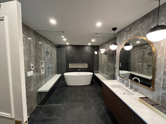 Bathroom Remodel - Located in Yorkville, Toronto, this luxury condominium remodelling is a project we are proud of. The scope included converting the master bathroom from his and hers, to one large bathroom with a shower wing that includes a free standing tub, two stone benches, heated towel rack, after removing the existing walls and changing the layout. We also remodeled the guest bathroom, the powder room and the entire suite except for the kitchen Bathroom Remodel - Located in Yorkville, Toronto, this luxury condominium remodelling is a project we are proud of. The scope included converting the master bathroom from his and hers, to one large bathroom with a shower wing that includes a free standing tub, two stone benches, heated towel rack, after removing the existing walls and changing the layout. We also remodeled the guest bathroom, the powder room and the entire suite except for the kitchen