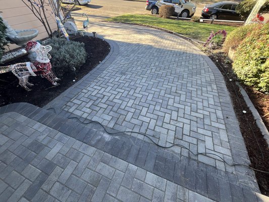 Salem, OR Paver Walkway - We recently completed this custom paver patio walkway for a homeowner in Salem, Oregon, designed to improve both curb appeal and everyday functionality. The new walkway creates a smooth, welcoming path through the yard while blending naturally with the home’s existing landscape. Built with durable, properly compacted pavers and clean edge detailing, this project was all about long-term performance and a polished finish. The result is a low-maintenance walkway that looks great, drains properly, and will hold up for years to come. Salem, OR Paver Walkway - We recently completed this custom paver patio walkway for a homeowner in Salem, Oregon, designed to improve both curb appeal and everyday functionality. The new walkway creates a smooth, welcoming path through the yard while blending naturally with the home’s existing landscape. Built with durable, properly compacted pavers and clean edge detailing, this project was all about long-term performance and a polished finish. The result is a low-maintenance walkway that looks great, drains properly, and will hold up for years to come.