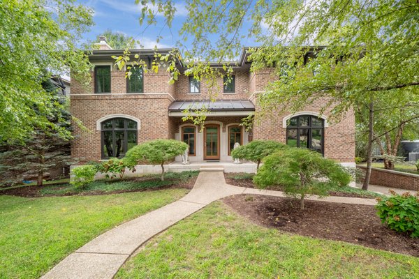 Gorgeous 2sty Clayton MO  SOLD! - 8304 Kingsbury Blvd Sold! Impressive Italianate style 2 story, full brick, with exquisite limestone trim, meticulously designed w/superior materials and artisan-quality craftsmanship, nestled in this Prime location of Clayton Gardens. Formal dining room hosts Walnut floor w/accent tile, elegant stone portal transitions to the fabulous hearth room, which is adjacent to the breakfast and wet bars, Chef's Kitchen, stained cherry cabinets, Dacor range, stainless countertop w/an island contrasted w/open shelf, natural cleft slate, convection oven, warming drawer, NEW built-in stainless refrigerator. Stately living room boasts Walnut floor, fireplace, built-in shelf. Sophisticated m/floor study w/wood ceiling beams. Steel staircase w/hardwood treads lead to the 2nd floor. Primary bedroom features a barrel-vault ceiling, walk-in closet, En suite luxury bath w/ two vanities, jet tub, dual shower w/refined hand-laid tiles. Additional bedrooms w/wood floor. Jack and Jill bath, full bath, 2nd floor laundry. W/out fin LL. Additional Rooms: Mud Room, Wine Cellar