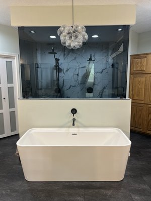 Bathroom Remodel 2025 - This bathroom was completely upgraded into a spa-like retreat, featuring a stunning freestanding soaking tub, a custom double-head shower with a full steam system, sleek dark glass, and modern matte black finishes. Finished off with a statement chandelier, this before-and-after transformation brings both luxury and relaxation to everyday living. Bathroom Remodel 2025 - This bathroom was completely upgraded into a spa-like retreat, featuring a stunning freestanding soaking tub, a custom double-head shower with a full steam system, sleek dark glass, and modern matte black finishes. Finished off with a statement chandelier, this before-and-after transformation brings both luxury and relaxation to everyday living.