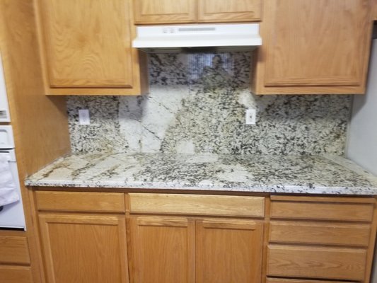 Granite countertops and backsplash - Tore out dated tile countertops and backsplash to Install new granite on the couters and backsplashes.  Dust and surface protection are key to every job.