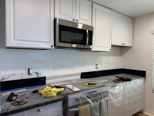 Tile Backsplash Installation for Kitchen 2025 - This kitchen backsplash project was done to refresh and modernize the space without a full remodel. We carefully installed a stylish tile design using a laser level for perfect alignment, ensuring a clean and professional look. After allowing the adhesive to fully cure, we completed the job with grout, silicone sealing, and reinstalling the outlets for a polished finish. The result added texture, color, and personality to the kitchen — the homeowner was thrilled with the final transformation!