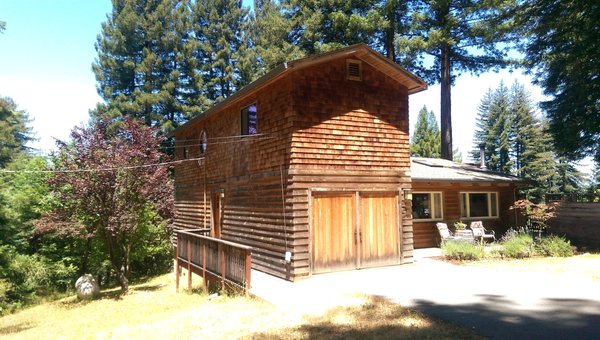 Exterior painting by Rolling Along Painting - This was a cedar shingle home.  The shingles had never been finished.  We clean, brightened and applied a coat of semi solid stain.  The homeowner was ecstatic.  Exterior painting and staining by Rolling Along Painting