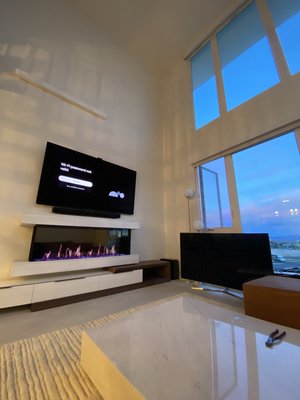 Evora Vegas Custom fireplace and Tv setup - Evora penthouse tv, soundbar, and custom led fireplace install with cabinetry. Evora Vegas Custom fireplace and Tv setup - Evora penthouse tv, soundbar, and custom led fireplace install with cabinetry.