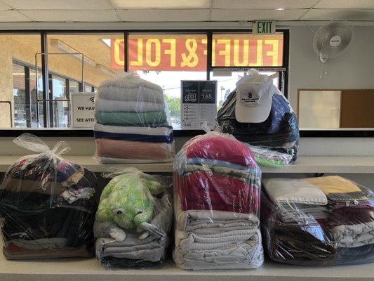 Fluff and Fold - Laundry is just one of those mundane things that we have to do weekly. Enjoy more time on more important matters by leaving your laundry with us. At Drop n Go Laundromat, we have fluff and fold service where you can drop off your dirty clothes at our laundromat, and we'll handle the rest. We specialize in Fluff and Fold at $1.00 per pound (minimum of 10 lbs). Take advantage of our wash and fold service today by contacting our laundromat! Fluff and Fold - Laundry is just one of those mundane things that we have to do weekly. Enjoy more time on more important matters by leaving your laundry with us. At Drop n Go Laundromat, we have fluff and fold service where you can drop off your dirty clothes at our laundromat, and we'll handle the rest. We specialize in Fluff and Fold at $1.00 per pound (minimum of 10 lbs). Take advantage of our wash and fold service today by contacting our laundromat!