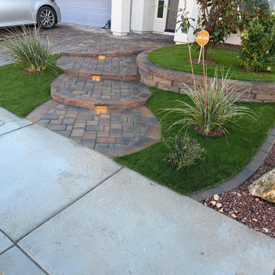 An Entrance That Sets the Tone - This custom entryway features elegant paver steps paired with a thoughtfully designed plant layout for a warm, welcoming first impression. Every detail works together to create a front entrance that feels refined, balanced, and built to stand out. An Entrance That Sets the Tone - This custom entryway features elegant paver steps paired with a thoughtfully designed plant layout for a warm, welcoming first impression. Every detail works together to create a front entrance that feels refined, balanced, and built to stand out.