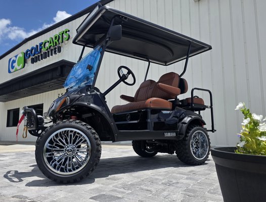 Custom 2026 Yamaha Drive² Build - A custom golf cart isn't just about adding accessories—it's about building it the right way.

This 2026 Yamaha Drive² arrived as a brand-new white cart and left our shop as a one-of-a-kind custom build, designed specifically for its owner's mountain property in Georgia.

Every stage of the transformation was completed in-house by our team, including the body conversion, lifted suspension, lithium battery system, upgraded controller, premium seating, electronics, wheels, tires, and countless finishing details.

Years of experience have taught us where shortcuts should never be taken. From proper wiring and quality components to clean installation and attention to detail, every cart is built as if it were our own.

When a cart leaves Golf Carts Unlimited, our goal is simple: it should look and perform like it came from the factory... only better.