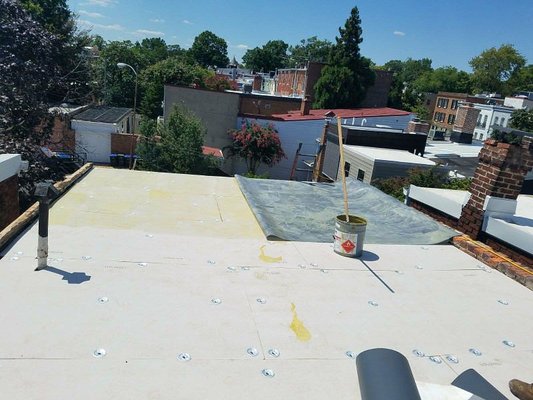 Washington DC TPO roof replacement - Removal of old mod bit flat roof and installation of a new .60 TPO membrane on a row home in Washington DC. Washington DC TPO roof replacement - Removal of old mod bit flat roof and installation of a new .60 TPO membrane on a row home in Washington DC.