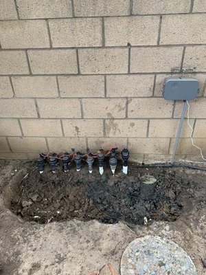 Valve replacement and pressure vacuum breaker installation - Client was sick of constant water coming out of the anti-syphon valves that created a constant muddy area around the valves and controller. By installing a Pressure vacuum breaker to protect the potable water supply all of the valves could be installed below grade for a cleaner look. This also eliminated the backflow of water in the area and will allow the area to be dry. Valve replacement and pressure vacuum breaker installation - Client was sick of constant water coming out of the anti-syphon valves that created a constant muddy area around the valves and controller. By installing a Pressure vacuum breaker to protect the potable water supply all of the valves could be installed below grade for a cleaner look. This also eliminated the backflow of water in the area and will allow the area to be dry.