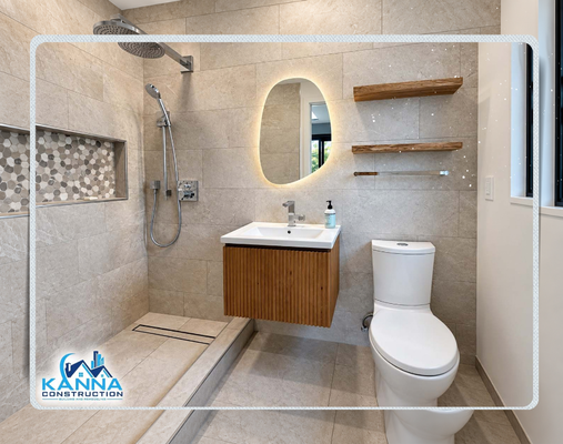 Point Loma | Hotel-Inspired Bathroom - A full bathroom transformation designed by Kanna Construction, blending modern minimalist aesthetics with warm natural wood tones and functional, high-end finishes.
Custom walk-in shower featuring a curbless entry, recessed tile niche, and rain showerhead. Includes a floating ribbed-wood vanity, backlit LED asymmetric mirror, floating wood shelves, and large-format porcelain tile flooring and walls. Point Loma | Hotel-Inspired Bathroom - A full bathroom transformation designed by Kanna Construction, blending modern minimalist aesthetics with warm natural wood tones and functional, high-end finishes.
Custom walk-in shower featuring a curbless entry, recessed tile niche, and rain showerhead. Includes a floating ribbed-wood vanity, backlit LED asymmetric mirror, floating wood shelves, and large-format porcelain tile flooring and walls.