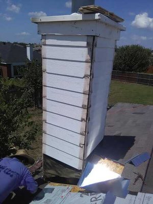Chimney Flashing and new Cricket - We replaced the bad siding on a chimney, built a cricket per code and painted. Chimney Flashing and new Cricket - We replaced the bad siding on a chimney, built a cricket per code and painted.